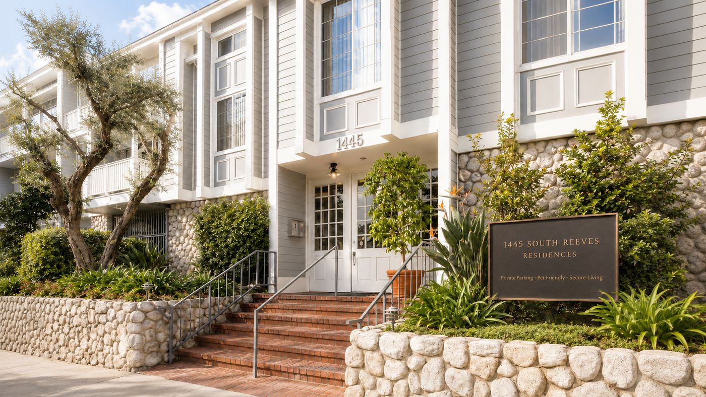 Front entrance of 1445 South Reeves Residences with bronze sign